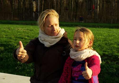  Teresa M.J. Catteeuw with a child - both giving thumbs up